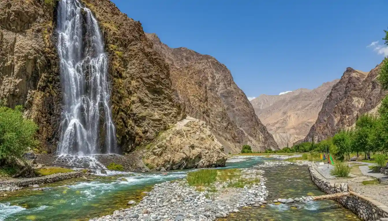 Mantoka Waterfall cascading down rocky cliffs on route between romantic honeymoon spots in Skardu