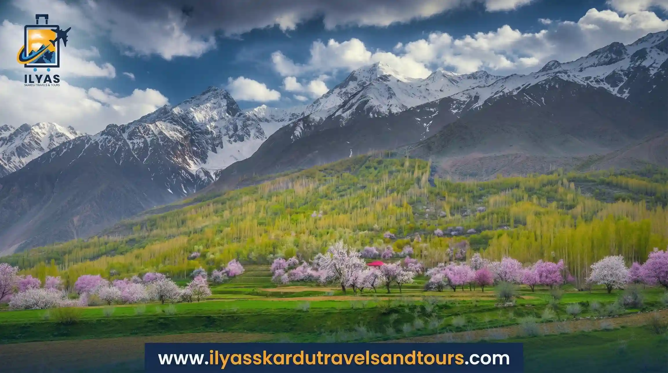 Choundha Valley in full spring bloom surrounded by mountains and forests.